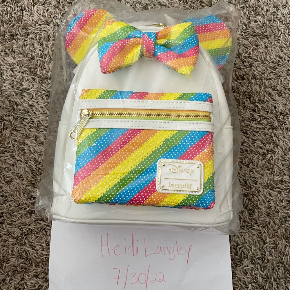 Brand new with tags Disney Loungefly Rainbow mini backpack.